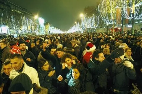 Revellers celebrate the New Year on the Champs Elysees avenue in Paris, Saturday Jan. 1, 2011 Ap